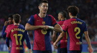 Lewandowski helps Liga leaders Barca past Getafe